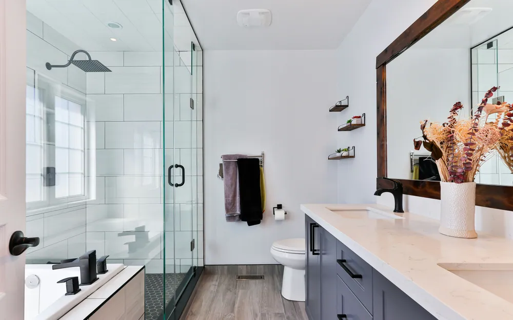 Renovated bathroom with a walk-in shower and modern vanity