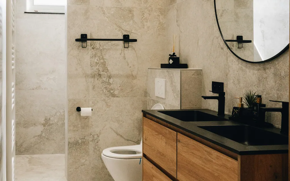 Spa-style bathroom renovation with tile floor and freestanding tub