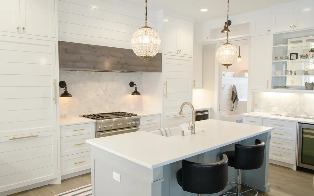 Bright kitchen remodel with quartz counters and two-tone cabinetry